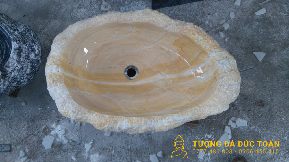 Lòng oval và lỗ thoát của lavabo đá vàng tự nhiên